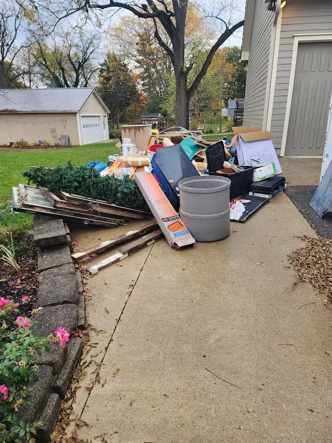 Dumpster being loaded with debris for Commercial Dumpster Rental in El Cerrito